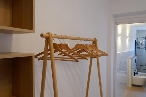 a wooden hanger in a kitchen next to a window at La Casina Massa in Massa