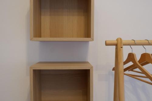 a closet with wooden shelves and a cabinet at La Casina Massa in Massa