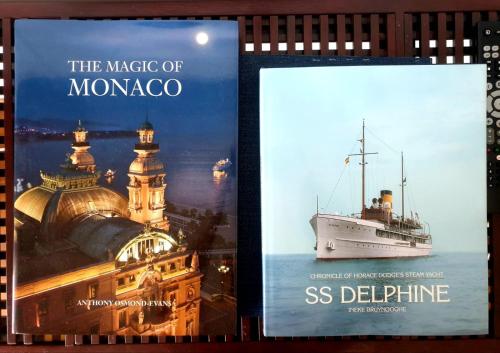 two posters of the magic of monaco and a cruise ship at Monaco Monte-Carlo Formula One in Monte Carlo