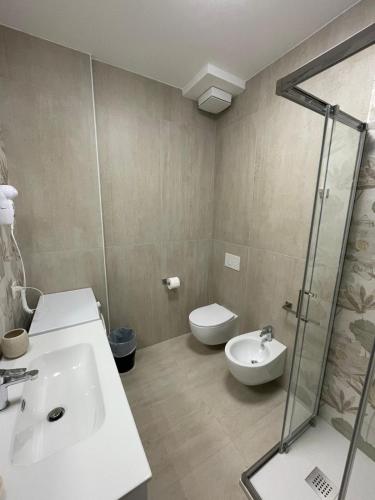a bathroom with a sink and a toilet and a shower at CASA NINA affittacamere 2 in Camerino