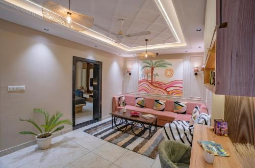 a living room with a couch and a table at Boutique Apartments By One Tree in Jodhpur