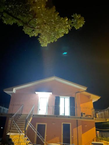 a house at night with the lights on at CASA NINA affittacamere 2 in Camerino