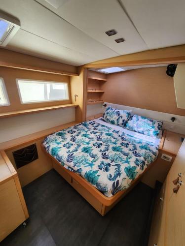 a bedroom of a boat with a bed in it at Spacious 52 ft Catamaran for Dockside Stay in Key West
