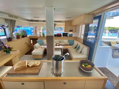 a kitchen and living room of a yacht at Spacious 52 ft Catamaran for Dockside Stay in Key West
