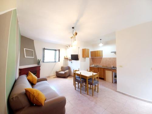 a living room with a couch and a table at Zi' Ciccio Casa Vacanze in Corleto Monforte