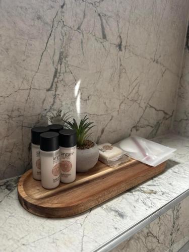 a wooden tray with products on a counter at EtnoLux Apartmani in Živinice