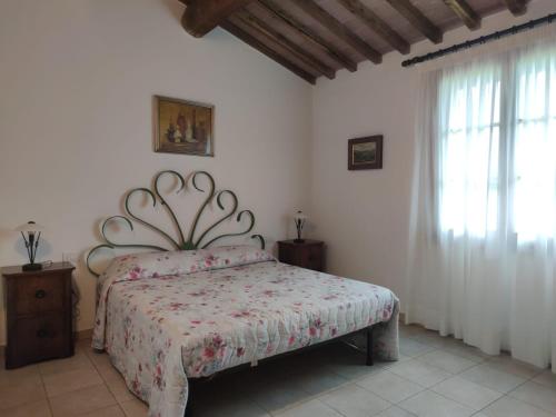 Postel nebo postele na pokoji v ubytování Agriturismo Poggio Nardini