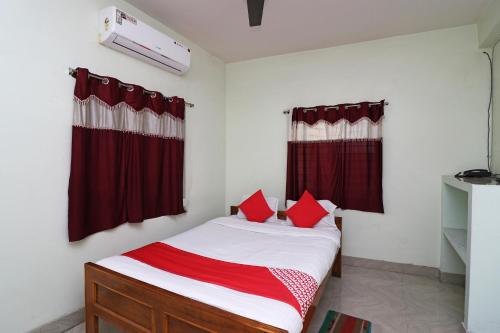 Ένα ή περισσότερα κρεβάτια σε δωμάτιο στο Super Hotel O Nandi Inn