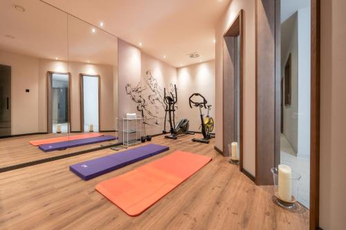 a yoga room with several yoga mats on the floor at Boutique Hotel Aichinger in Nussdorf am Attersee