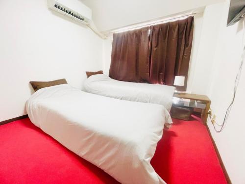 Katil atau katil-katil dalam bilik di Sakura 305, near Itami Airport Long-term stays possible Japanese scenery, Sakura Apartment