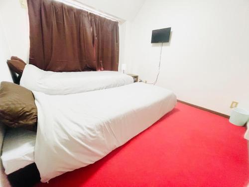 Katil atau katil-katil dalam bilik di Sakura 305, near Itami Airport Long-term stays possible Japanese scenery, Sakura Apartment