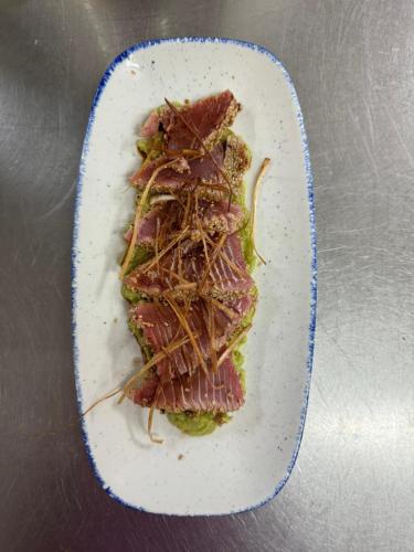 a white plate with a piece of food on it at Hotel Robert in La Pobla de Claramunt