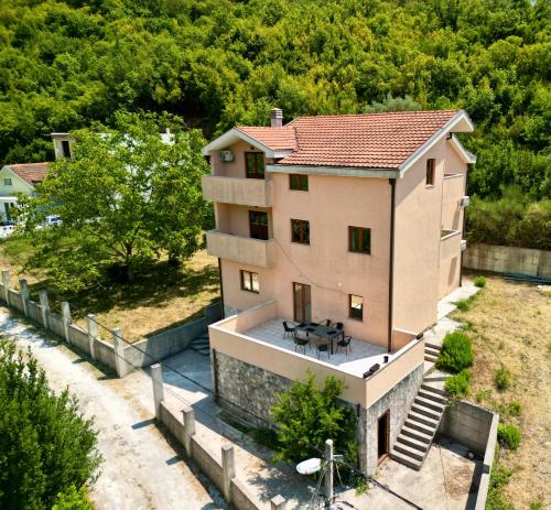 an aerial view of a house with a patio at MonteHygge apartments in Tivat