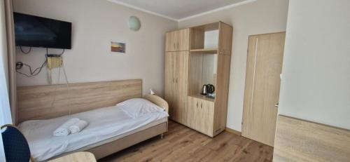 Postel nebo postele na pokoji v ubytování Sanatorium Albatros