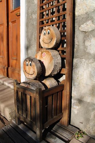 a pile of buns with faces painted on them at Da Bino - Vicino Pista Ciclabile in Valle di Cadore