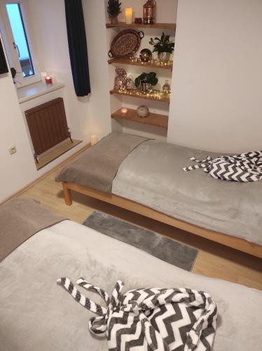 a living room with two beds and a window at Apartment Müllerstiege in Hallstatt