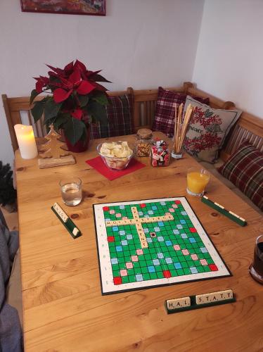 a wooden table with a chess board on it at Apartment Müllerstiege in Hallstatt