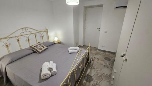 Ένα ή περισσότερα κρεβάτια σε δωμάτιο στο Jasmine House Apartament 8 pax Ustica