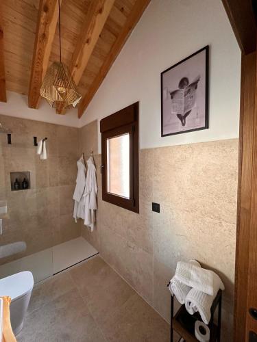 a bathroom with a shower and a sink and a toilet at Casa rural Los Acebos in La Cuesta