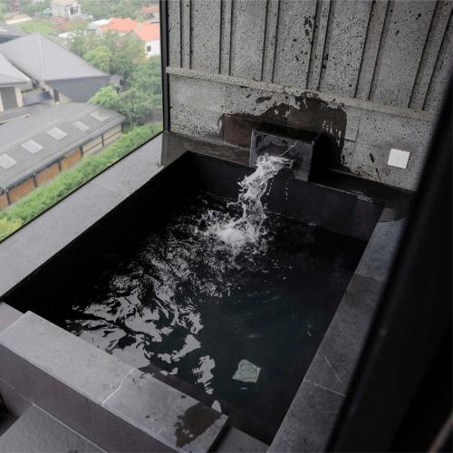 a pool of water in a window of a building at Lynn Times Thanh Thuỷ hotspring-KS 35 tầng- My Home in Phú Thọ