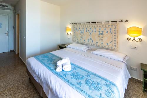 Postel nebo postele na pokoji v ubytování Hotel Castello