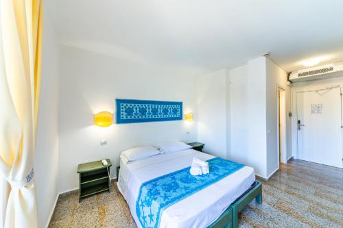 Postel nebo postele na pokoji v ubytování Hotel Castello