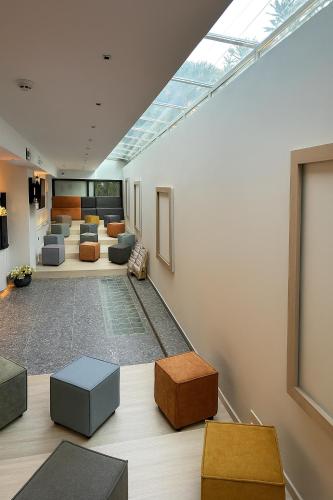 a living room with a skylight on the ceiling at Flisvos Royal Hotel & Suites in Tolo