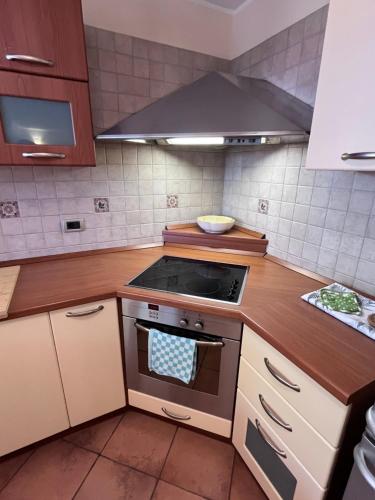 a kitchen with a stove top oven in a kitchen at Noa & Dan in Koper