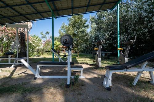 a group of exercise equipment in a park at Palma Village by Greek Pride Hotels in Skála Foúrkas