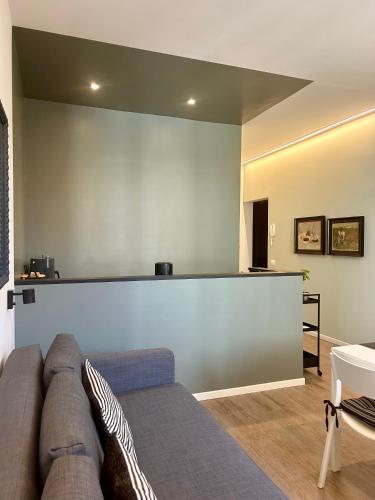 a living room with a couch and a table at Suite Apartments - Corso51 in Rimini