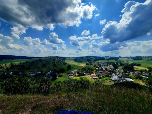 a small village in the hills under a cloudy sky at Apartment bei Nürburgring, Parking, Homeoffice in Blankenheim