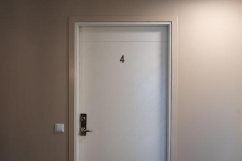 a door with the number four on it at SteneBo 