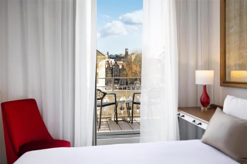 Postel nebo postele na pokoji v ubytování Tivoli Doelen Amsterdam Hotel