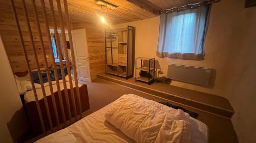 Ένα ή περισσότερα κρεβάτια σε δωμάτιο στο Appartement Cosy Formiguères