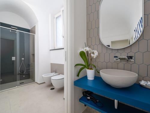 a bathroom with a sink and a mirror at Blu Sky Luxury Palace Sorrento Coast in Meta
