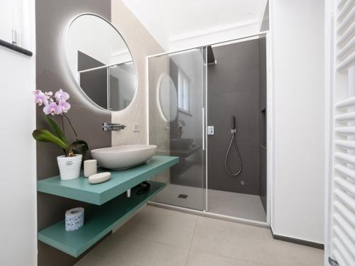 a bathroom with a sink and a mirror at Blu Sky Luxury Palace Sorrento Coast in Meta