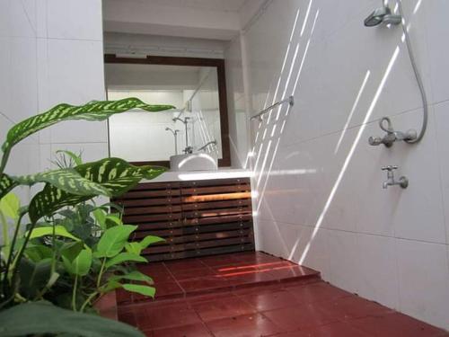 a bathroom with a sink and a mirror at Wildlight Yala in Yala