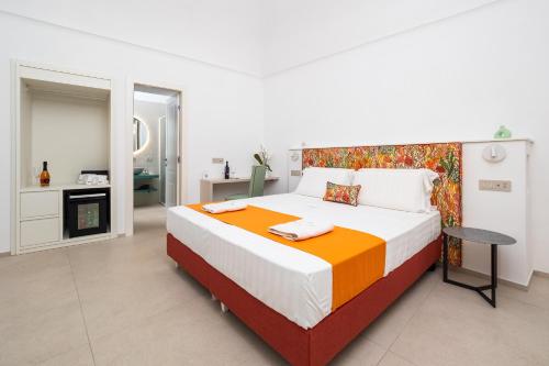 a bedroom with a large bed and a fireplace at Blu Sky Luxury Palace Sorrento Coast in Meta