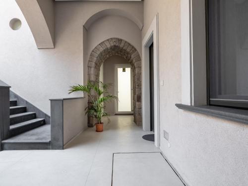 an internal hallway of a house with a plant at Blu Sky Luxury Palace Sorrento Coast in Meta