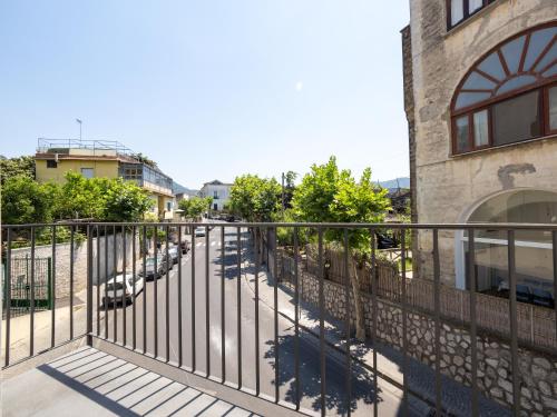 a balcony with a fence next to a building at Blu Sky Luxury Palace Sorrento Coast in Meta