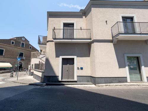 a large building with two balconies on a street at Blu Sky Luxury Palace Sorrento Coast in Meta