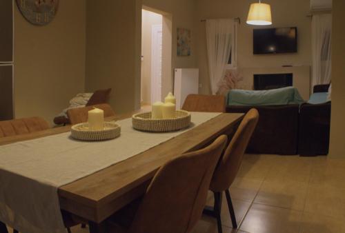 a living room with a table with candles on it at AMMOS in Salamís