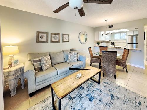 a living room with a couch and a table at Ocean Village Club N16 in Saint Augustine