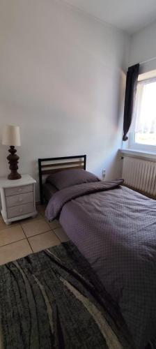 Postel nebo postele na pokoji v ubytování Monteurwohnung am Heideresort Brüggen