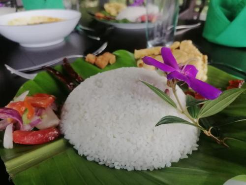 a plate of rice and vegetables on a banana leaf at AHAS GAWWA Boutique in Padukka