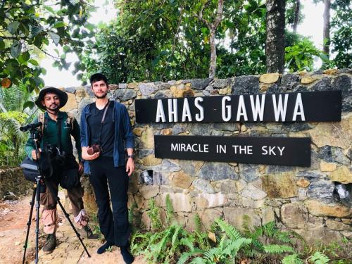 two men standing in front of a sign at atlas ganuwa miracle in at AHAS GAWWA Boutique in Padukka