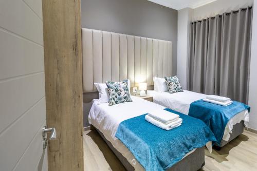 Ένα ή περισσότερα κρεβάτια σε δωμάτιο στο Elridge Living
