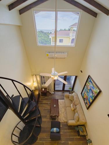 an overhead view of a living room with a large window at Louis' Apartments in Placencia Village
