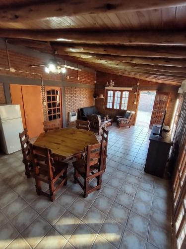 a large room with a wooden table and chairs at Carpe Diem! Brand new in Malargue in Malargüe