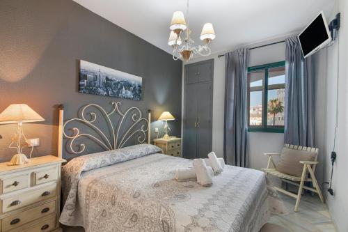 Postel nebo postele na pokoji v ubytování El Portil Apartamento
